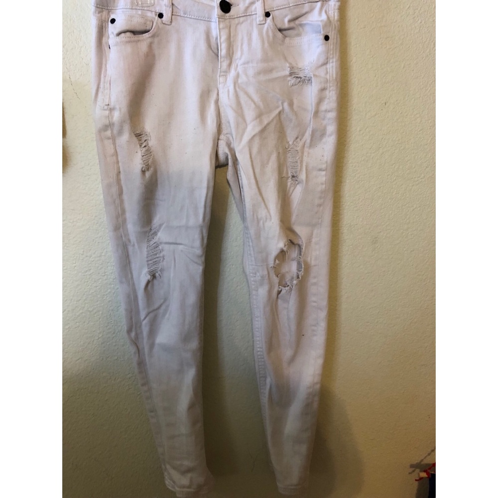 Distressed white denim